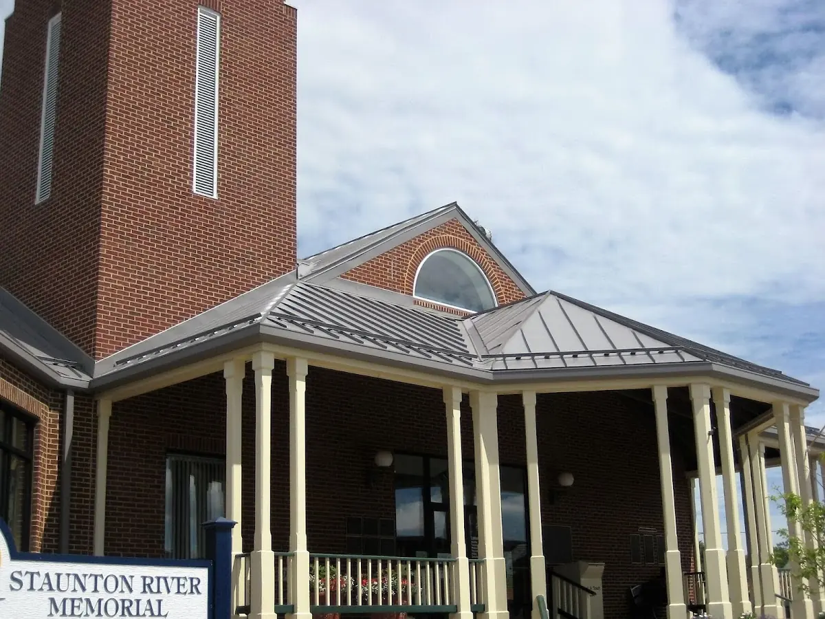 Skilled roofing craftsmen working on a residential roof in Attawaugan